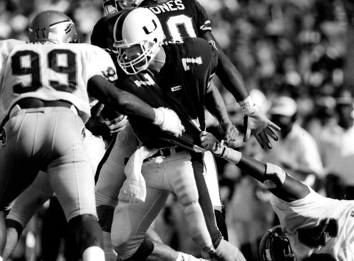 UM quarterback Craig Erickson is sacked by FSU in the Orange Bowl.