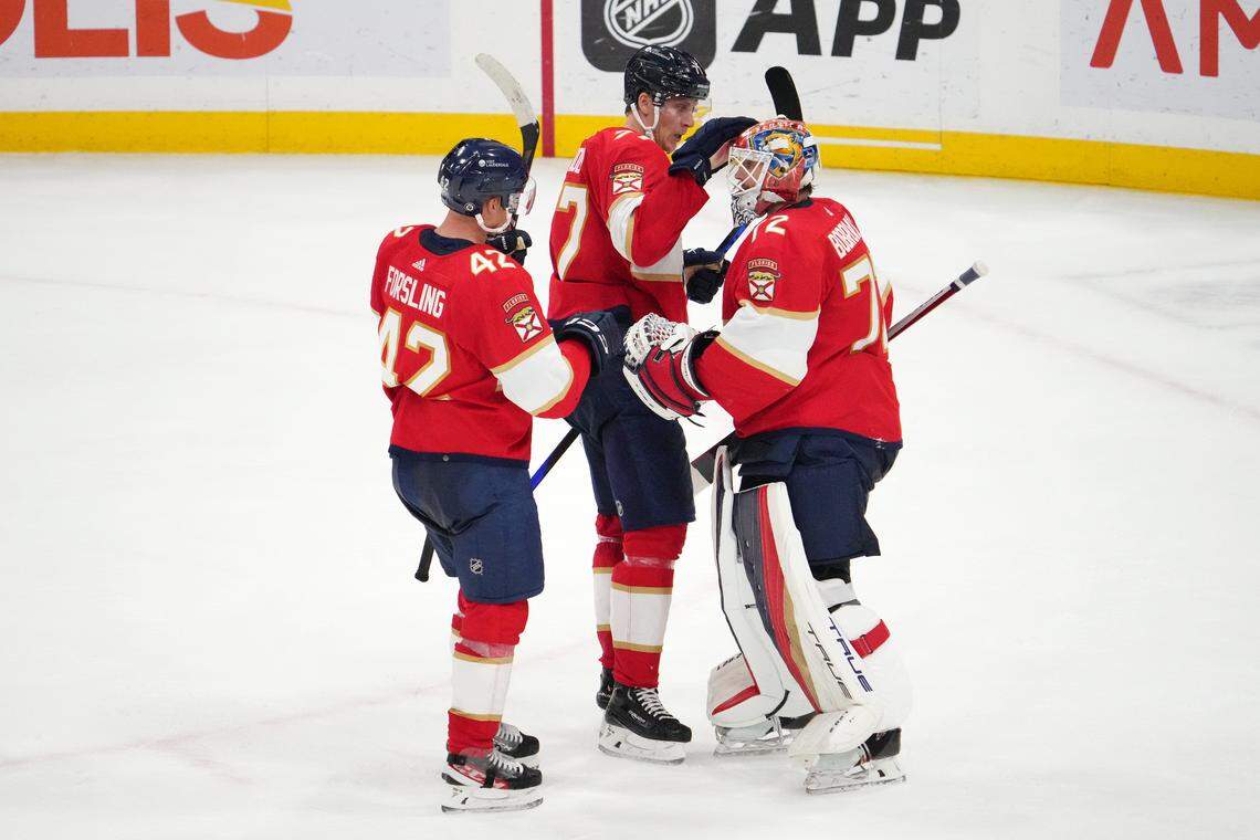 Oct 28, 2023; Sunrise, Florida, USA; Florida Panthers goaltender Sergei Bobrovsky (72) celebrates with defenseman Niko Mikkola (77) and defenseman Gustav Forsling (42) after defeating the Seattle Krakenat Amerant Bank Arena.