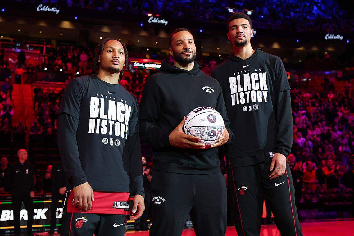 Jahmir Young #17, Norman Powell #24 and Kel'el Ware #7 of the Miami Heat receive recognition for being selected for All Star Weekend activities before the game against the Utah Jazz at Kaseya Center on February 9, 2026 in Miami.