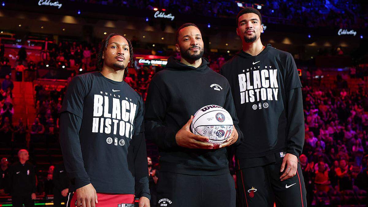 Jahmir Young #17, Norman Powell #24 and Kel'el Ware #7 of the Miami Heat receive recognition for being selected for All-Star Weekend activities before the game against the Utah Jazz at Kaseya Center on February 9, 2026 in Miami.