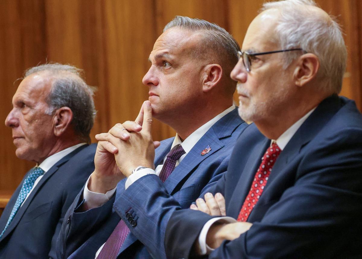 Frank Artiles, center, sits with his attorneys and Frank Quintero, left, and Jose Quiñon, right, wait for the jury to return a verdict during his trial on inside Courtroom 4-1 at the Richard E. Gerstein Justice Building on Monday, September 30, 2024, in Miami, Florida.
