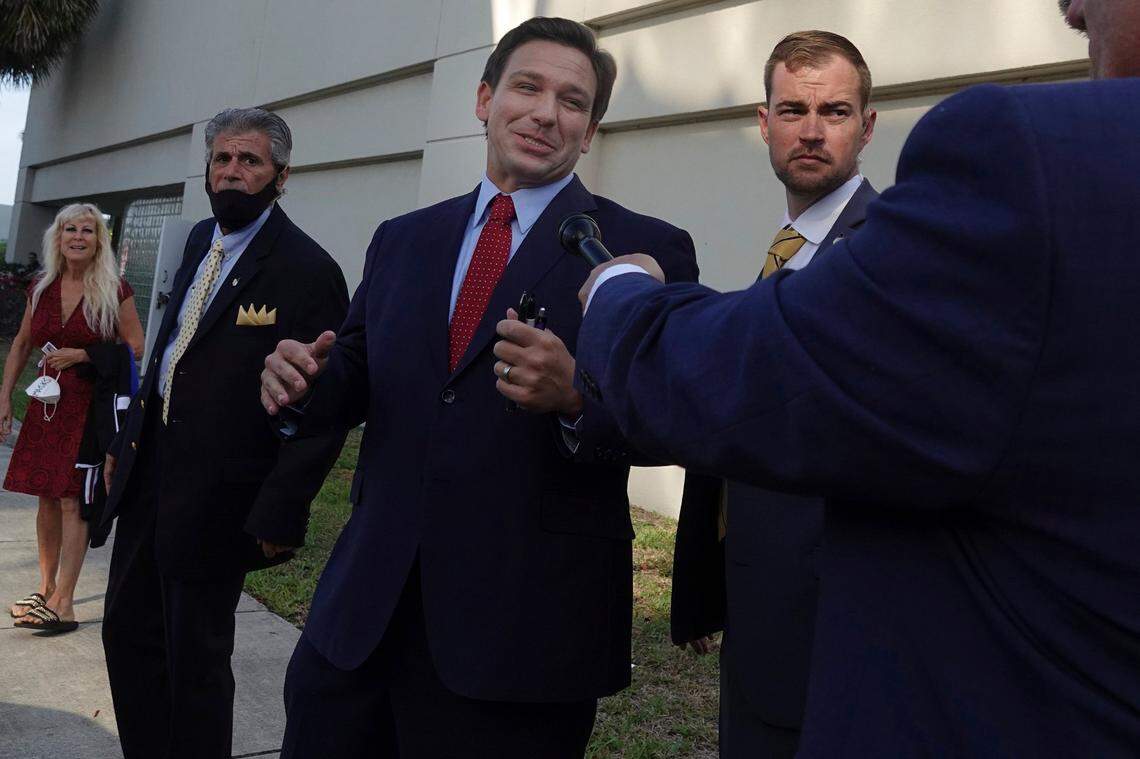 Florida Gov. Ron DeSantis leaves the site of an appearance, Thursday, May 6, 2021, in West Palm Beach, where he signed a sweeping elections bill into law. The event was closed to the news media except for Fox News.