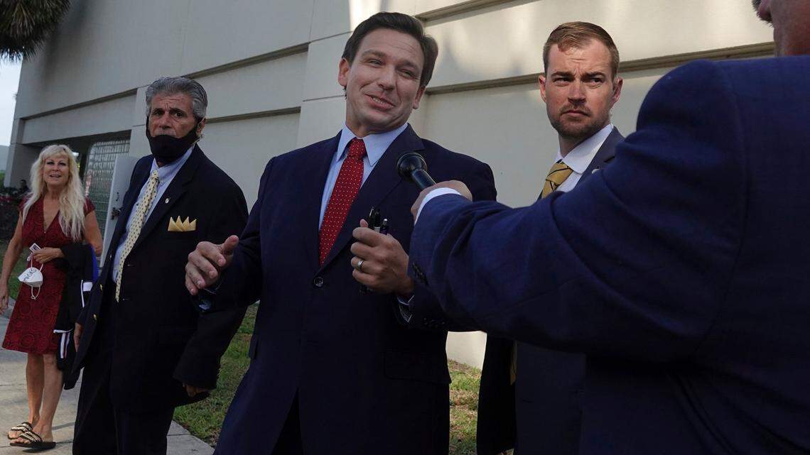 Florida Gov. Ron DeSantis leaves the site of an appearance, Thursday, May 6, 2021, in West Palm Beach, where he signed a sweeping elections bill into law. The event was closed to the news media except for Fox News.