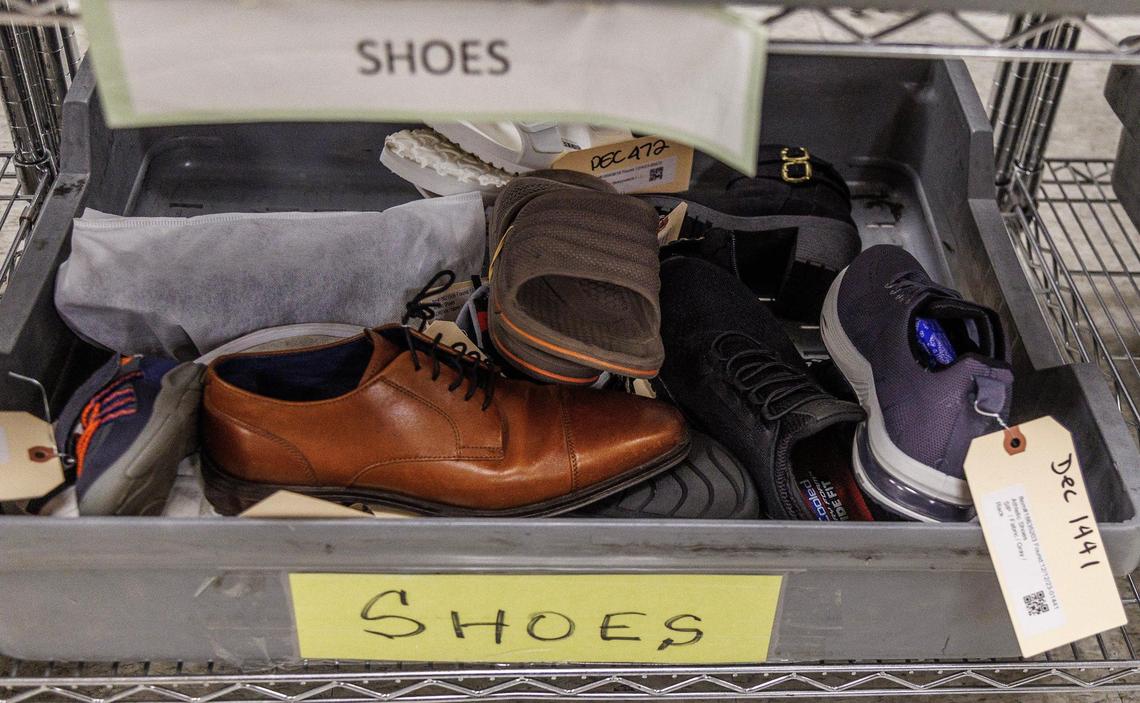 View of items left behind by passengers including shoes, stored at the Lost and Found department at Miami International Airport, till owners claim them, on Tuesday December 13, 2023.