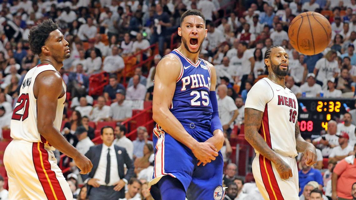 Miami Heat Justise Winslow (20) and James Johnson (16) watch as Philadelphia 76ers Ben Simmons (25) screams after a dunk in the fourth quarter in Round 1, Game 3, at the AmericanAirlines Arena in Miami, Florida, April 19, 2018.