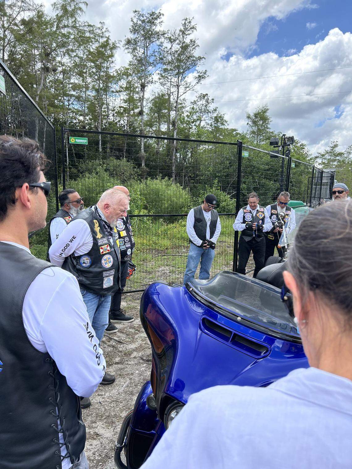 Archbishop of Miami Thomas Wenski prayed with members of the Knights on Bikes ministry at the last month at the entrance of ‘Alligator Alcatraz’,  Florida’s immigrant detention center in the Everglades. 
