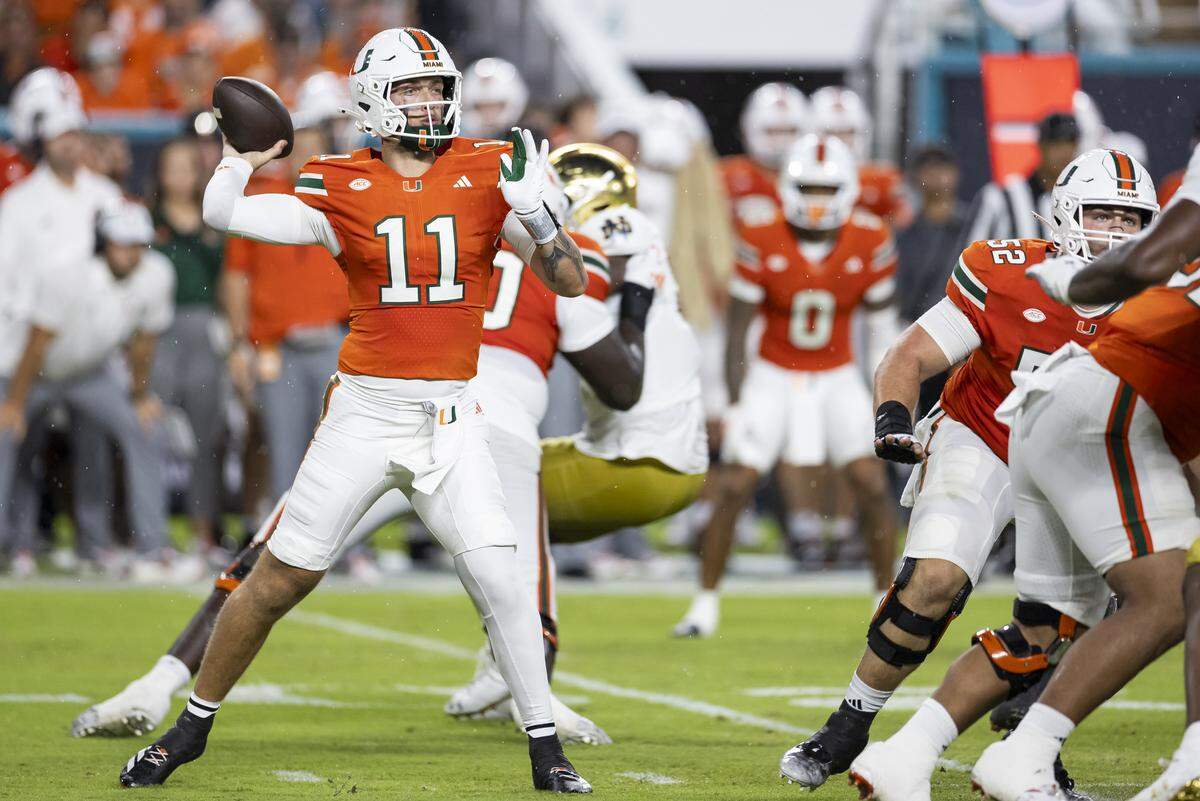 Miami Hurricanes quarterback Carson Beck (11) looks to throw the ball in the first half of his NCAA football game against Notre Dame Fighting Irish at Hard Rock Stadium on Sunday, Aug. 31, 2025, in Miami Gardens, Fla.