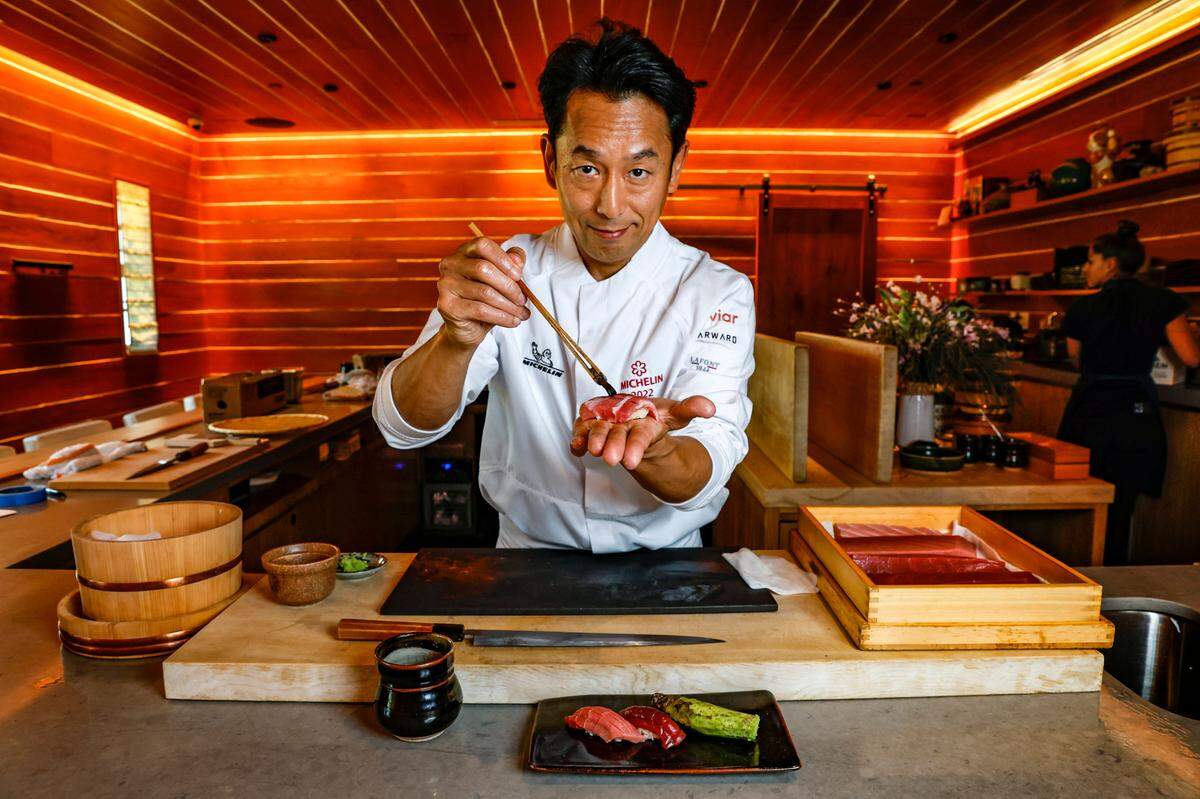 Head Chef Atsushi Okawara of The Den at Azabu prepares a curated omakase dinner on Miami Beach, Florida.