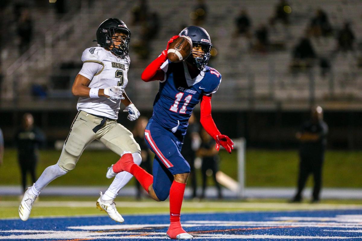 Columbus wide receiver Fadrelle Andrus (11) catches the football for a touchdown during the second quarter of a high school football semifinal game against Ocoee at Tropical Park in Miami, Florida, Friday, December 2, 2022.