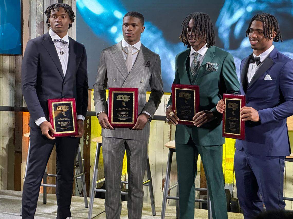 Chaminade-Madonna wide receiver Jeremiah Smith (left) poses with the three other finalists for the CBS Miami Nat Moore Trophy at a ceremony at Hard Rock Stadium on Tuesday night. Smith was joined on stage (from left to right) by Lions teammate Jojo Trader, Miami Central wide receiver Lawayne McCoy and St. Thomas Aquinas running back Jordan Lyle.