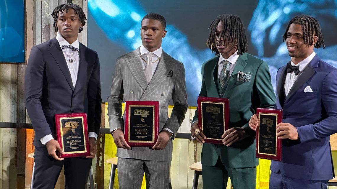 Chaminade-Madonna wide receiver Jeremiah Smith (left) poses with the three other finalists for the CBS Miami Nat Moore Trophy at a ceremony at Hard Rock Stadium on Tuesday night. Smith was joined on stage (from left to right) by Lions teammate Jojo Trader, Miami Central wide receiver Lawayne McCoy and St. Thomas Aquinas running back Jordan Lyle.