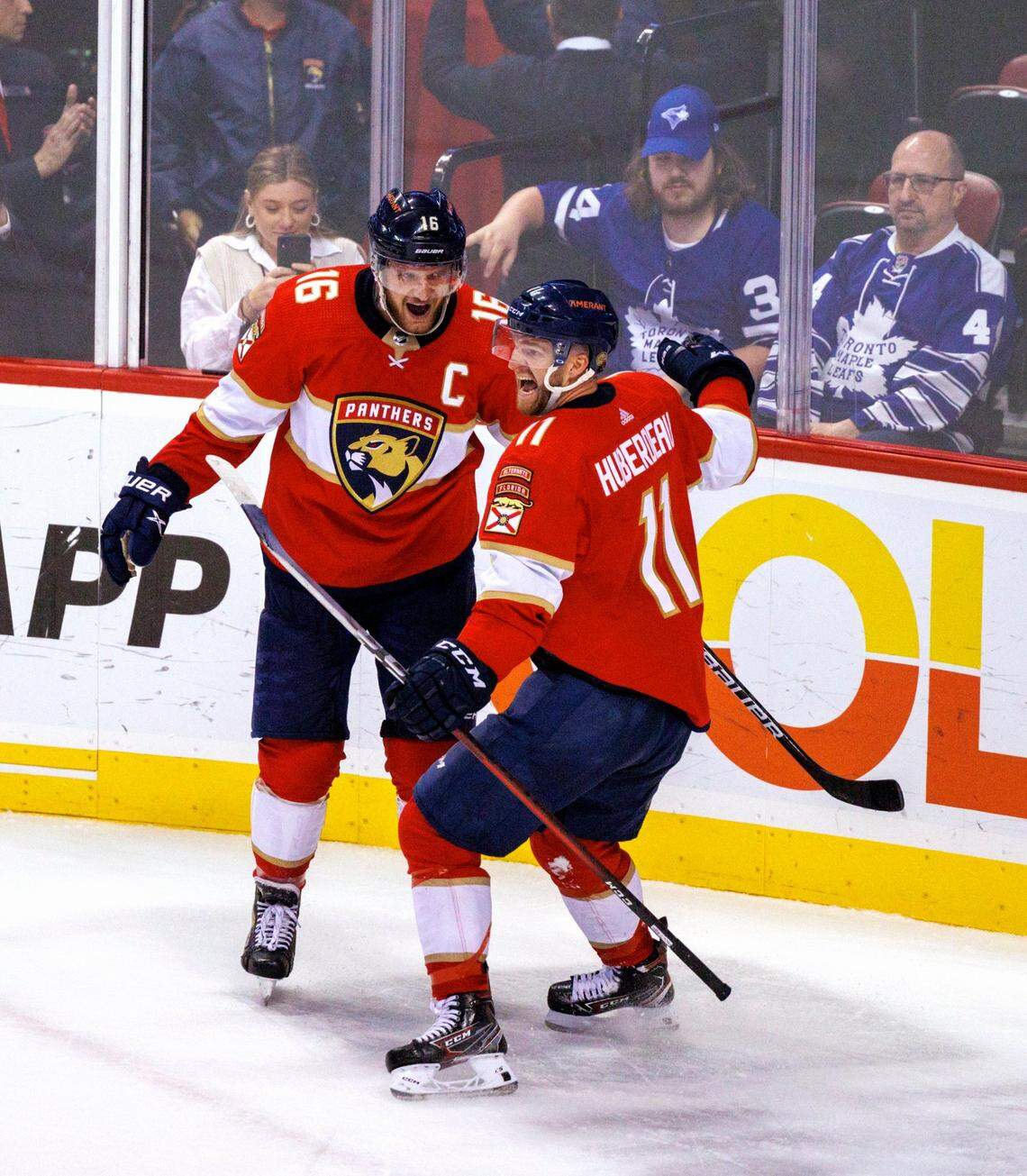 Florida Panthers left wing Jonathan Huberdeau (11) celebrates with teammate Aleksander Barkov (16) after scoring the winning goal against Toronto Maple Leafs goaltender Jack Campbell (36) during overtime of an NHL game at the FLA Live Arena on Tuesday, April 5, 2022 in Sunrise, Fl.