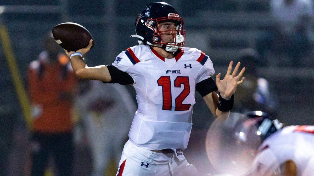 Miramar quarterback Kael Alexander (12) sets up to pass during the first half of a high school football game against Homestead at Harris Field Park in Homestead, Florida, on Friday, November 25, 2022.