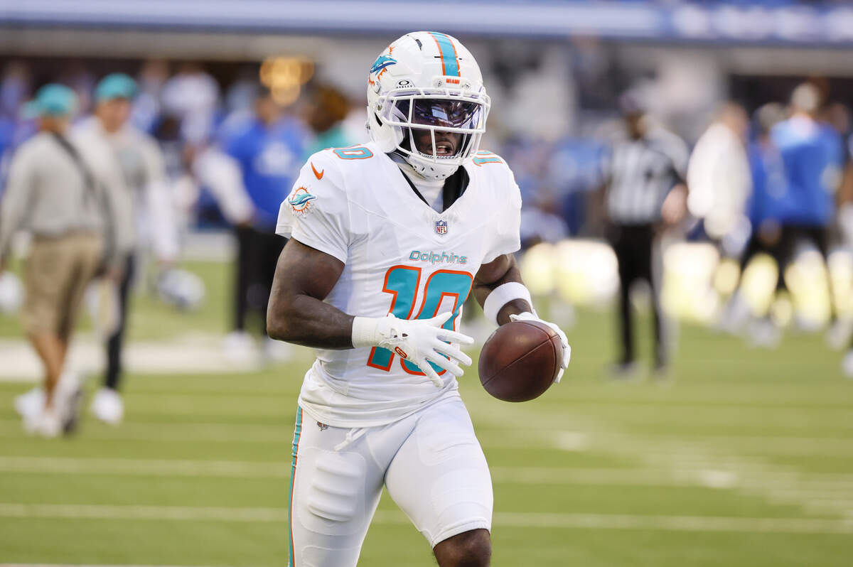 Miami Dolphins wide receiver Tyreek Hill (10) warms up before an NFL game against the Indianapolis Colts at Lucas Oil Stadium on Sunday, Sept. 7, 2025, in Indianapolis.