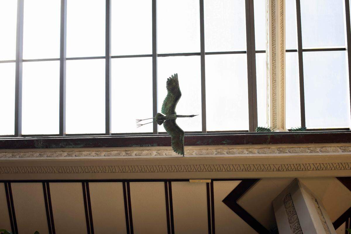 One of the copper crane accents soars overhead at Mayfair House Hotel & Garden.
