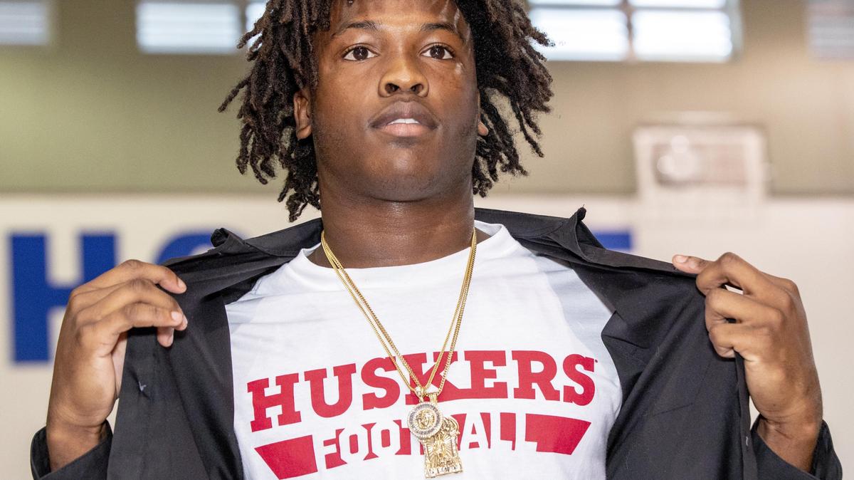 Jaiden Francois shows off his Nebraska football shirt after choosing the midwestern school over the hometown Miami Hurricanes during college signing day at South Dade High School in Homestead, Florida, on Wednesday, December 18, 2019.