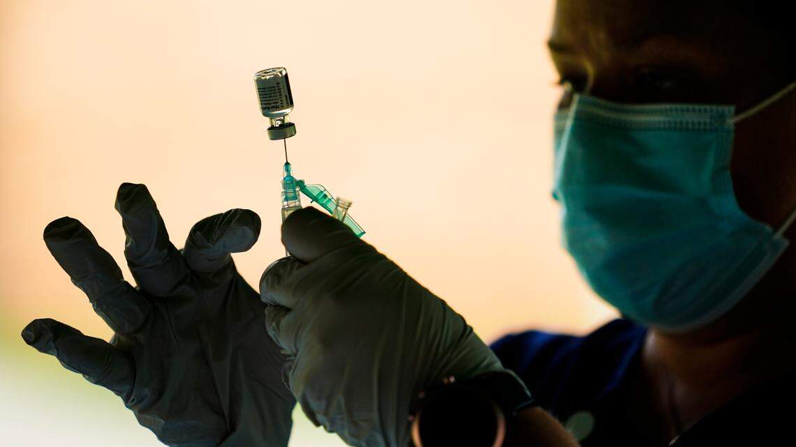 A syringe is prepared with the Pfizer COVID-19 vaccine at a clinic at the Reading Area Community College in Reading, Pa., on Sept. 14, 2021.