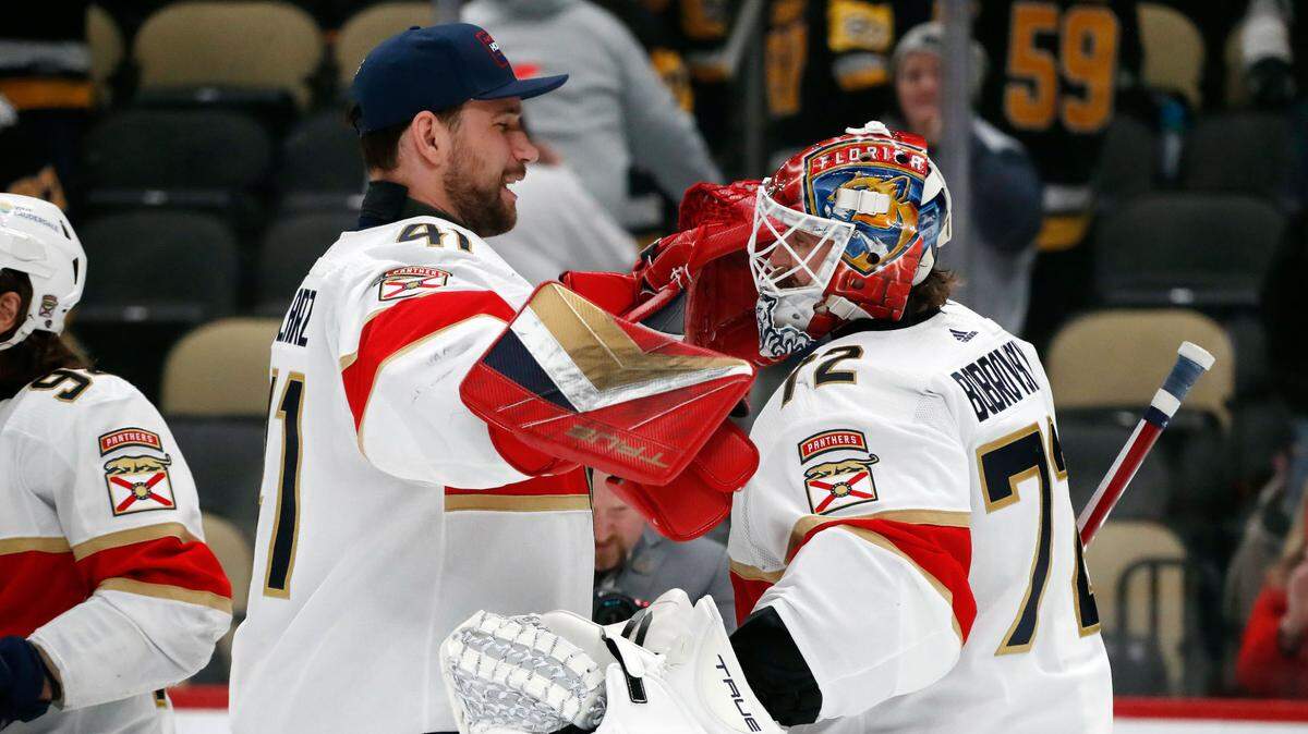 Feb 14, 2024; Pittsburgh, Pennsylvania, USA; Florida Panthers goaltenders Anthony Stolarz (41) and Sergei Bobrovsky (72) celebrate after defeating the Pittsburgh Penguins at PPG Paints Arena.