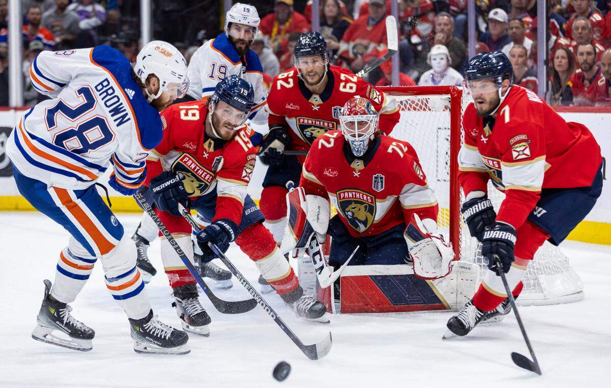 Florida Panthers left wing Matthew Tkachuk (19), defenseman Brandon Montour (62), goaltender Sergei Bobrovsky (72) and defenseman Dmitry Kulikov (7) work to stop Edmonton Oilers right wing Connor Brown (28) from scoring in the second period of Game 7 of the Stanley Cup Final at Amerant Bank Arena on Monday, June 24, 2024, in Sunrise, Fla.