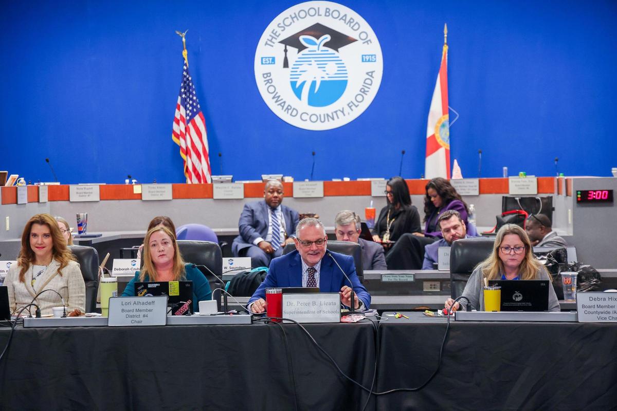 Superintendent Peter B. Licata, center, addresses board members, local stakeholders and members of the community gathered for a workshop to address potential school closings.