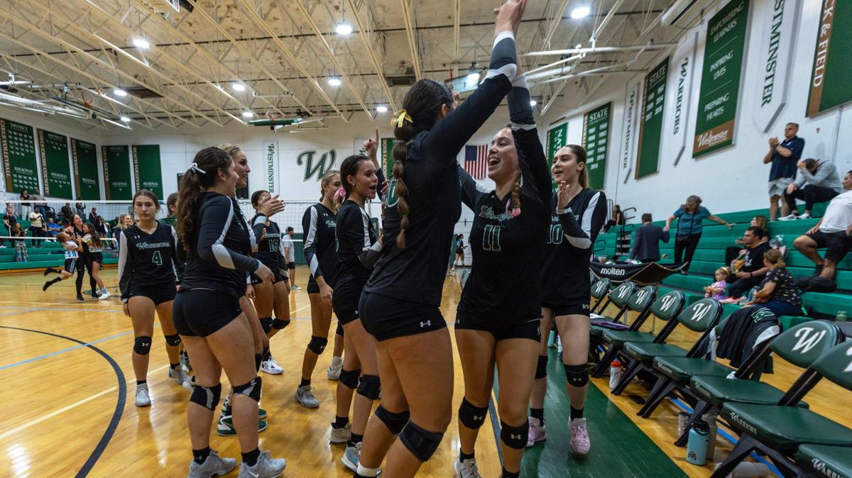 Westminster Christian girl’s volleyball team celebrates after defeating Ransom Everglades during the girls volleyball regional championship game at Westminster Christian School in Miami, Florida, on Tuesday, October 31, 2023.