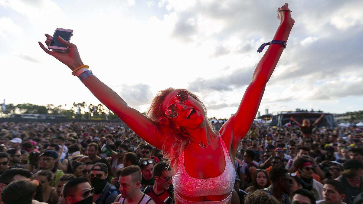 A festival goer enjoys music during the 2019 Ultra Music Festival in Virginia Key, Florida on Friday, March 29, 2019.