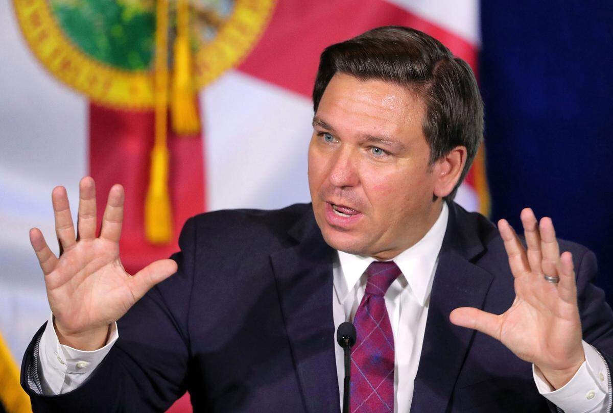 Florida Gov. Ron DeSantis, seen here during a roundtable discussion with theme park leaders about coronavirus safety protocols in 2020, vowed to fight Disney’s “special privileges” after the company opposed a parental-rights bill because of its impact on LGBTQ youth. 