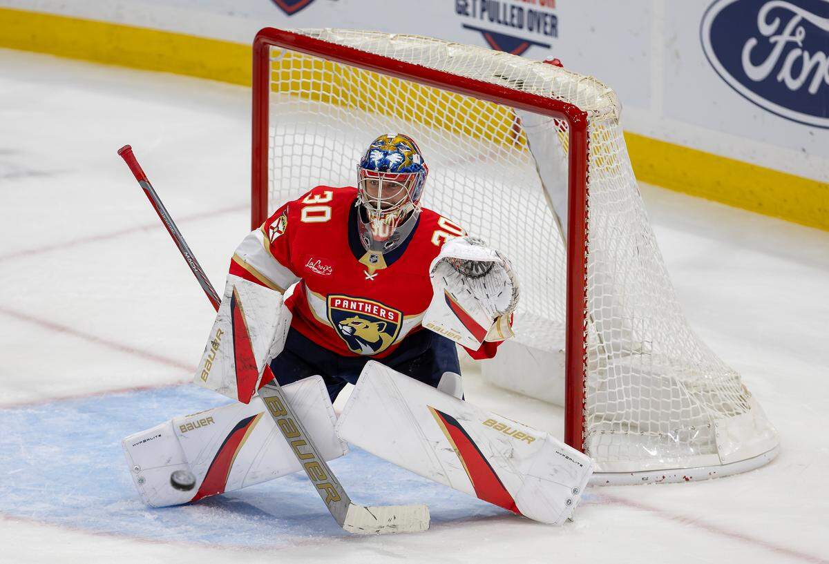 Florida Panthers goaltender Spencer Knight (30) keeps his focus on the puck while defending during the first period of an NHL game against the Montreal Canadiens at Amerant Bank Arena on Saturday, Dec. 28, 2024, in Sunrise, Florida.