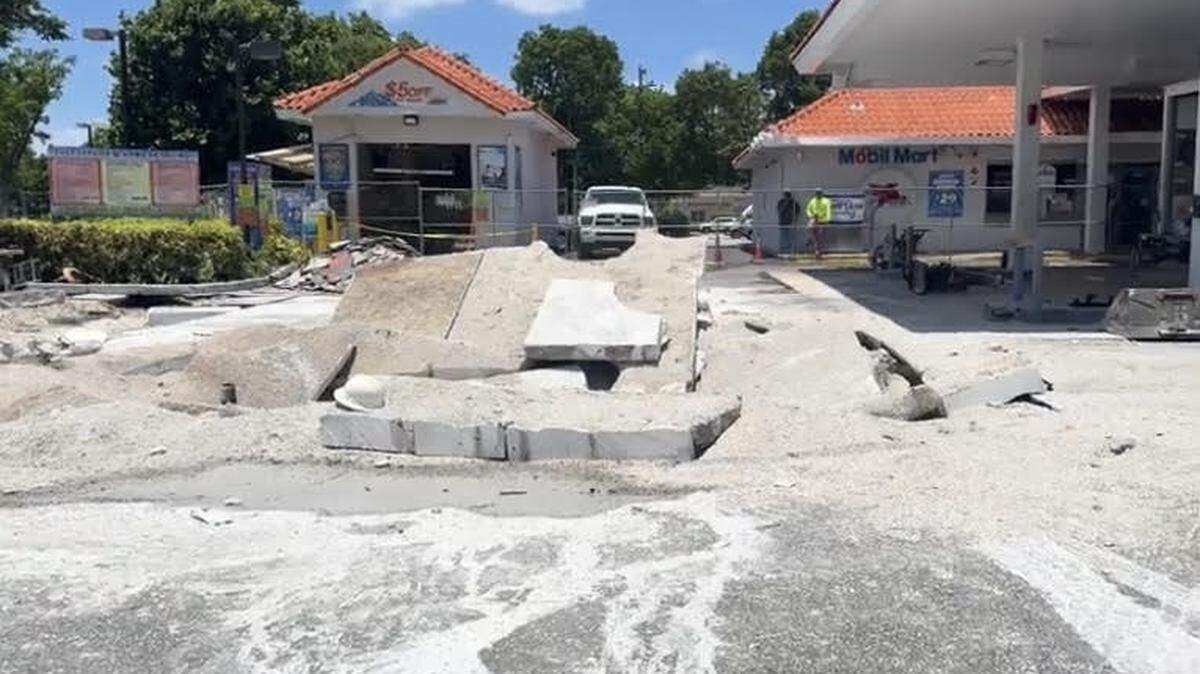 A parking lot is buckled because of an underground fuel tank explosion at a Hallandale Beach gas station Tuesday, June 4, 2024.