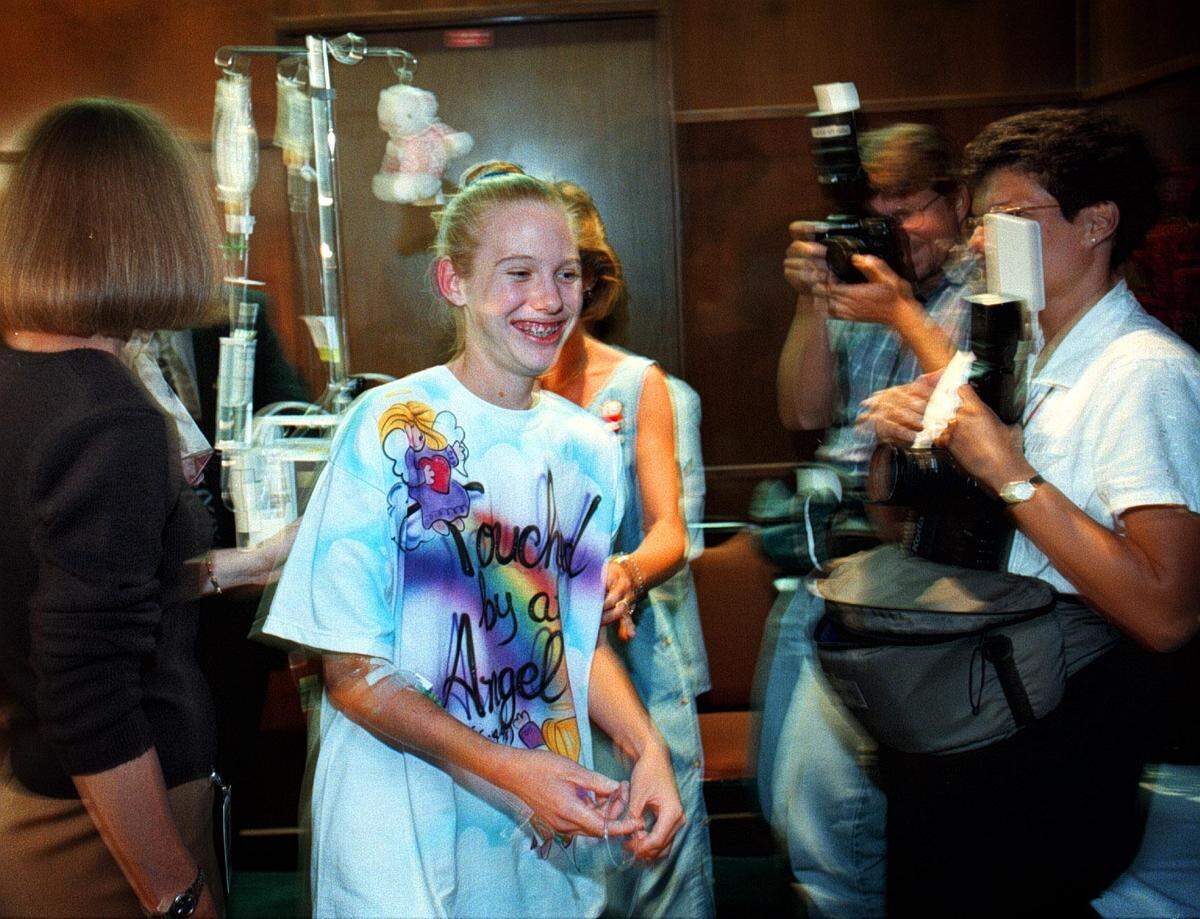 BROWARD-6-16-98--Twelve year old Stephanie Murray met the press this afternoon prior to being released from Broward General Medical Center, where she has been hospitalized after being impaled by a steel rod that flew off the highway and through the window of her mother’s van while they were driving down I-95. She wore a tee shirt with “Touched by an Angel” printed on it, that was given to her by a friend.
