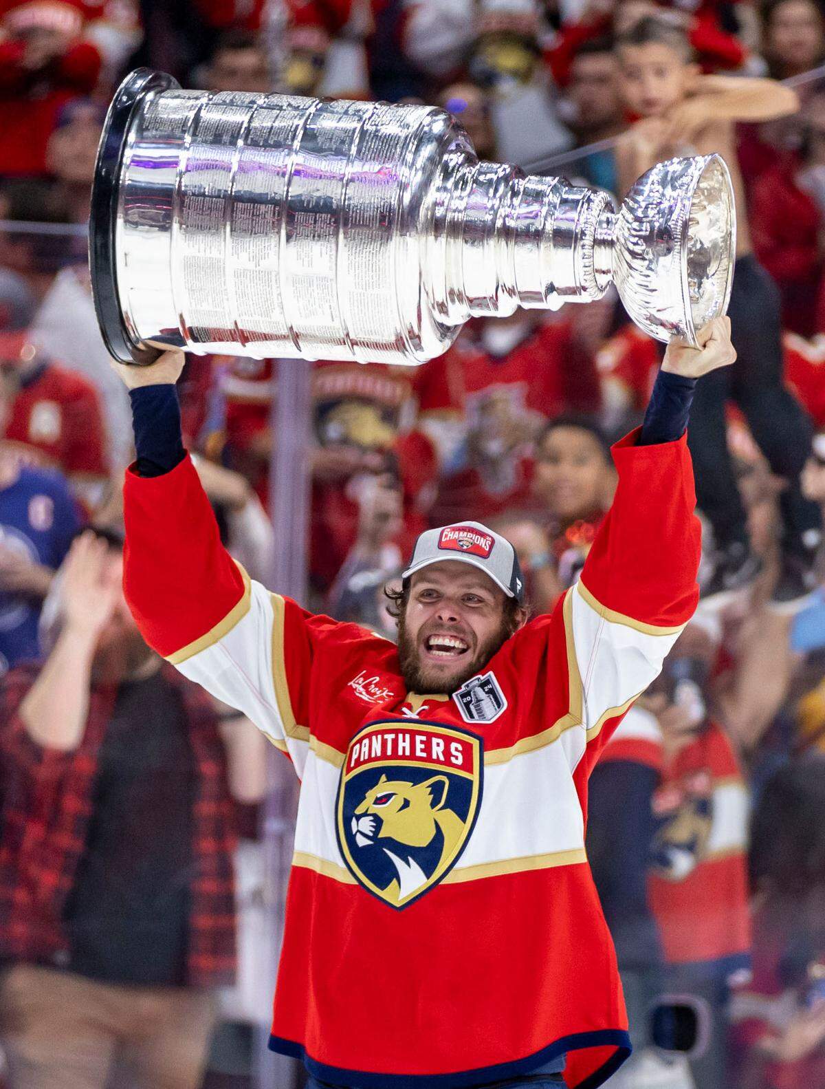 Sunrise, Florida, June 24, 2024 - Carter Verhaeghe lifts the Stanley Cup after the Panthers defeated the Edmonton Oilers in game 7 of the Stanley Cup Final