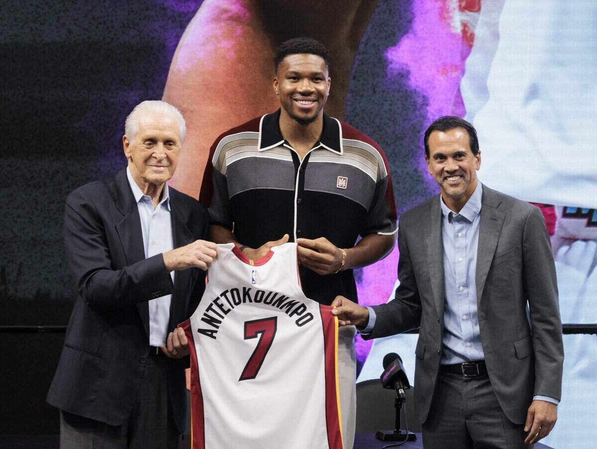 Giannis Antetokounmpo poses with Pat Riley, President of the Miami Heat, left, and Head Coach Erik Spoelstra during a press conference introducing Portis to the Miami Heat on Thursday, July 16, 2026, at the Kaseya Center in downtown Miami, Fla.