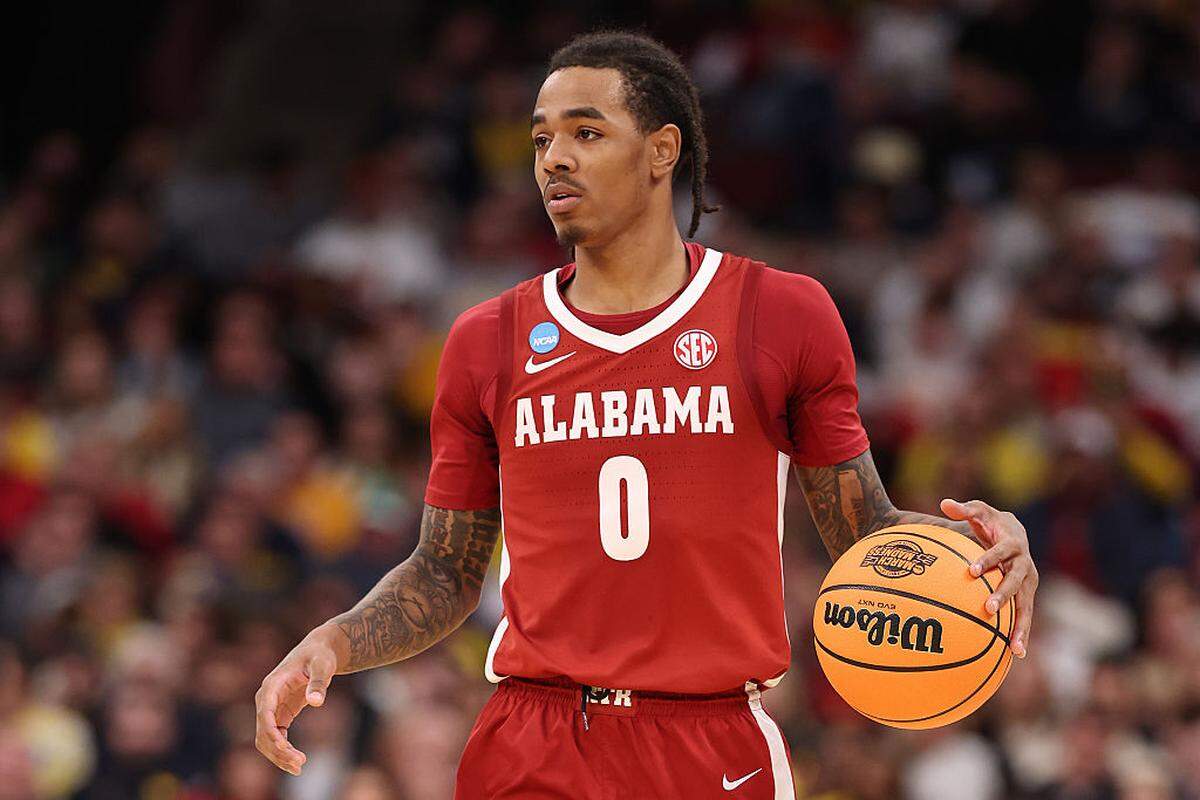 Labaron Philon #0 of the Alabama Crimson Tide dribbles against the Michigan Wolverines in the Sweet Sixteen of the 2026 NCAA Men's Basketball Tournament at the United Center on March 27, 2026 in Chicago, Illinois.