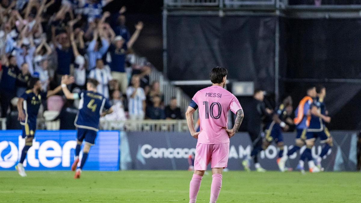 Inter Miami forward Lionel Messi (10) watches Vancouver Whitecaps players celebrate after they scored a goal in the second half of their Concacaf Champions Cup Semifinals match at Chase Stadium on Wednesday, April 30, 2025, in Fort Lauderdale, Fla.