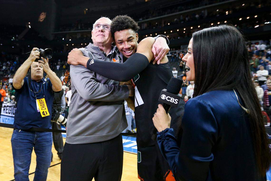 Mar 26, 2023; Kansas City, MO, USA; Miami Hurricanes head coach Jim Larranaga left, hugs guard Jordan Miller (11) as they celebrate defeating the Texas Longhorns at the T-Mobile Center.