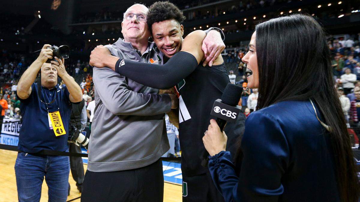 Mar 26, 2023; Kansas City, MO, USA; Miami Hurricanes head coach Jim Larranaga left, hugs guard Jordan Miller (11) as they celebrate defeating the Texas Longhorns at the T-Mobile Center. Mandatory Credit: William Purnell-USA TODAY Sports