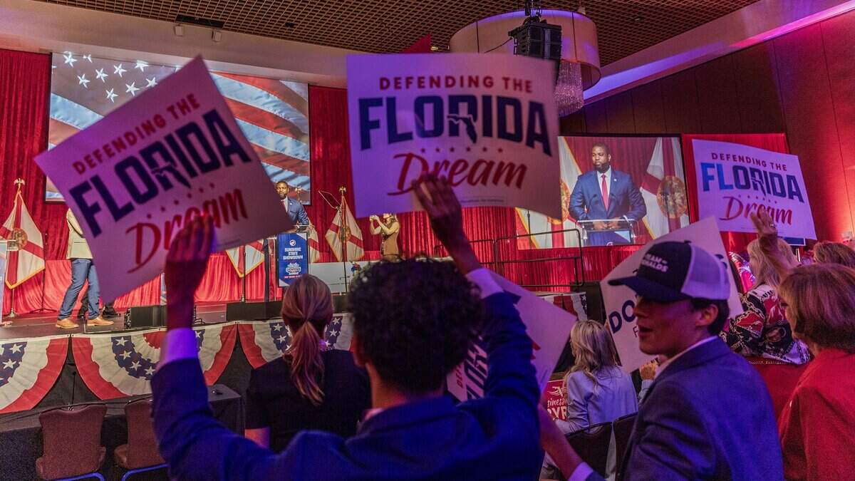 Supporters of Florida gubernatorial candidate Rep. Byron Donalds display campaign posters during the Republican Party of Florida’s Sunshine State Showdown in Hollywood on June 27, 2026.