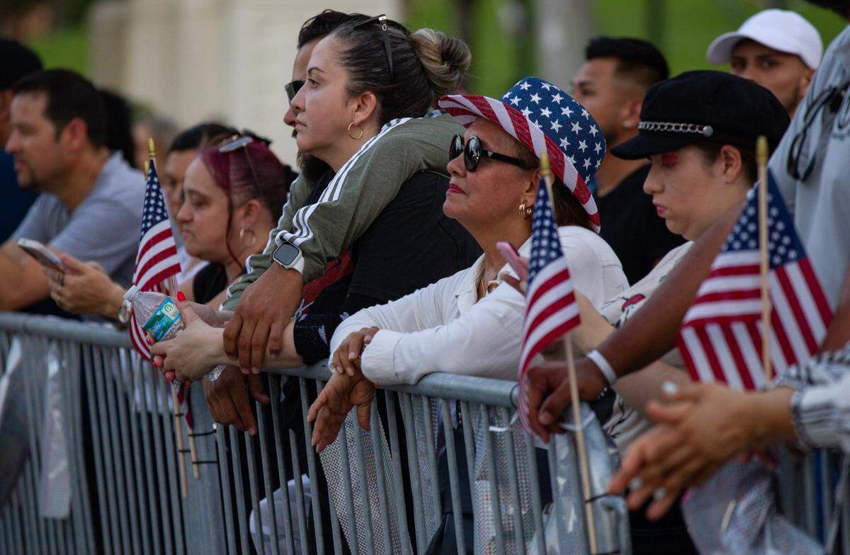 Attendees watch musical performances during the Fourth of July Bayfront Park Celebration at Bayfront Park on Tuesday, July 4, 2023 in Miami, Fla.