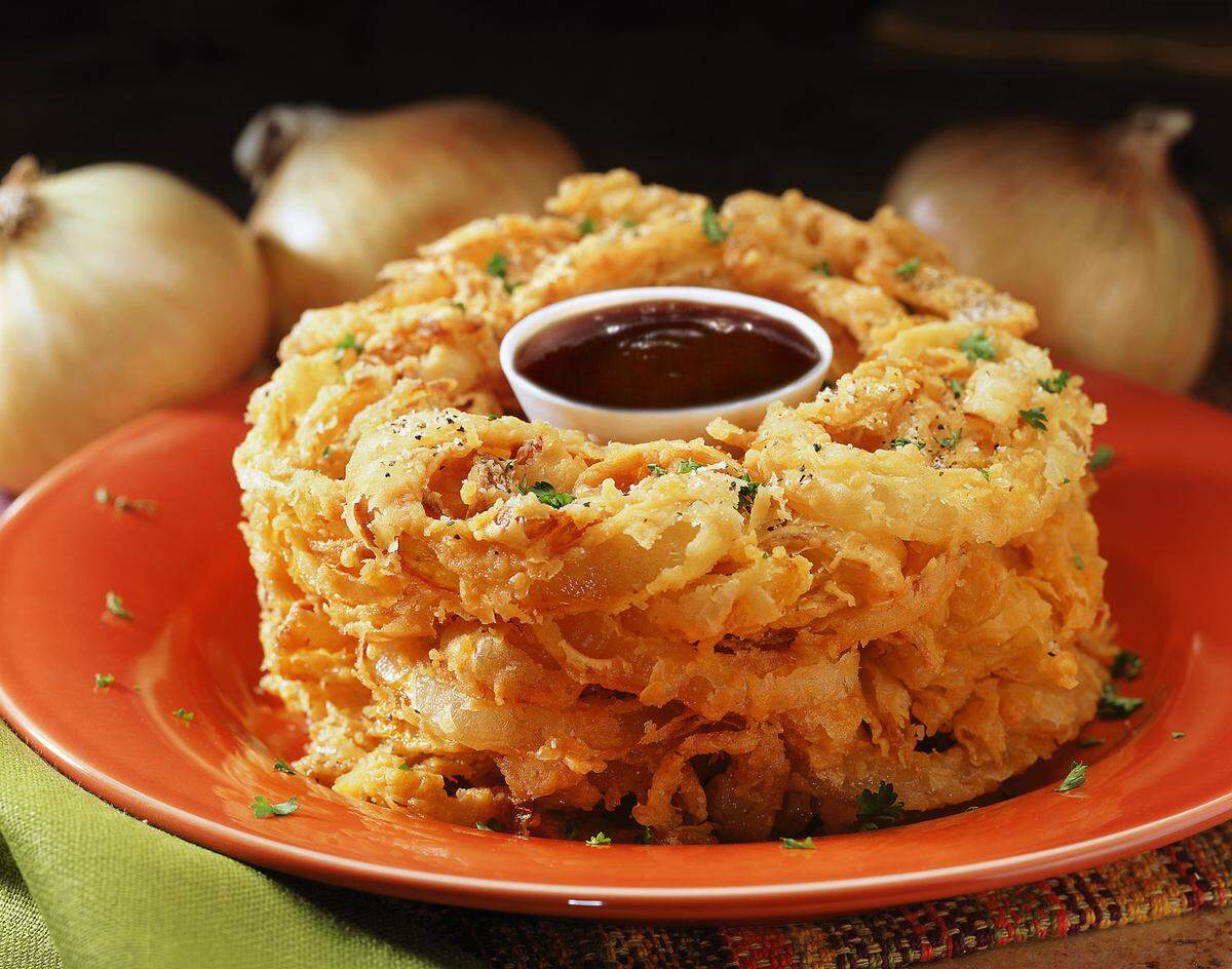 Old timers will tell you the onion loaf used to be rectangular. Whatever its shape, it was fried salty heaven.