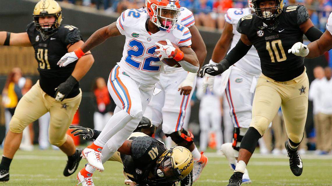 Lamical Perine of the Florida Gators rushes against the Vanderbilt Commodores during the first half at Vanderbilt Stadium on October 13, 2018, in Nashville, Tennessee. Perine was recruited by Alabama but turned the Crimson Tide down.