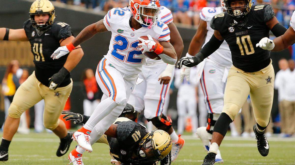 Lamical Perine of the Florida Gators rushes against the Vanderbilt Commodores during the first half at Vanderbilt Stadium on October 13, 2018, in Nashville, Tennessee. Perine was recruited by Alabama but turned the Crimson Tide down.