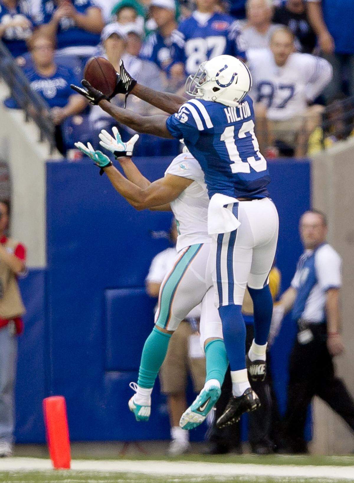 Wide receiver T.Y. Hilton catches this pass for a long gain in front of cornerback Brent Grimes in the second quarter of the game with the Miami Dolphins and the Indianapolis Colts at Lucas Oil Stadium in Indianapolis on September 15th,2013.