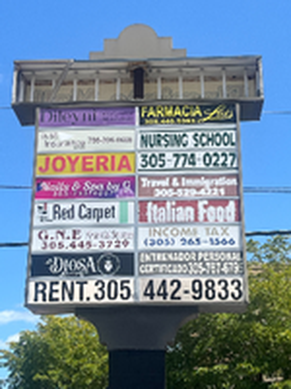 A sign still lists the number for the Future Tech Institute, a Miami for-profit school that is now closed.