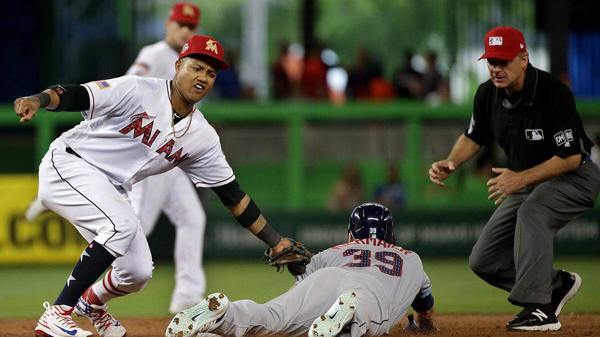 Marlins second baseman Starlin Castro tags out Tampa Bay's center fielder Kevin Kiermaier in the third inning of the Miami Marlins vs. Tampa Bay Rays game at Marlins Park Wednesday, July 4, 2018.