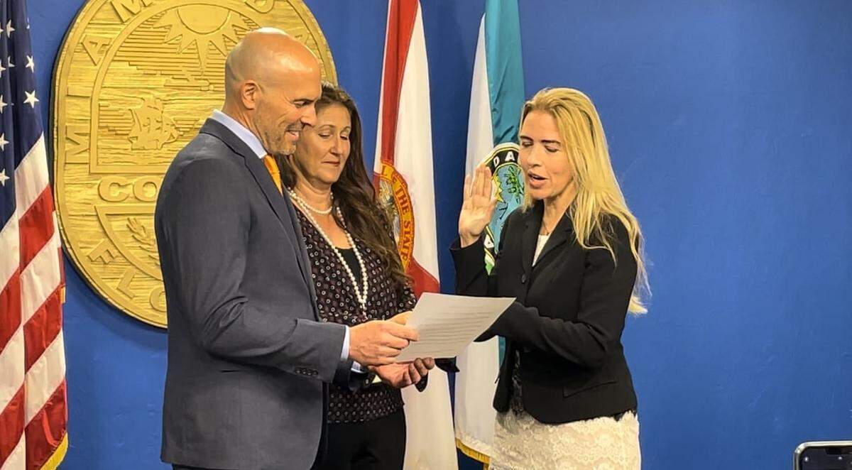 Luis Montaldo, left, presides over the Nov. 22, 2022, swearing-in of Miami-Dade Commissioner Raquel Regalado as interim vice chair of the board. At the time, Montaldo was general counsel of the Miami-Dade Clerk of the Courts office. Following the Dec. 31 death of Clerk Harvey Ruvin, Montaldo was named interim clerk on Jan. 2 by Chief Judge Nushin Sayfie.