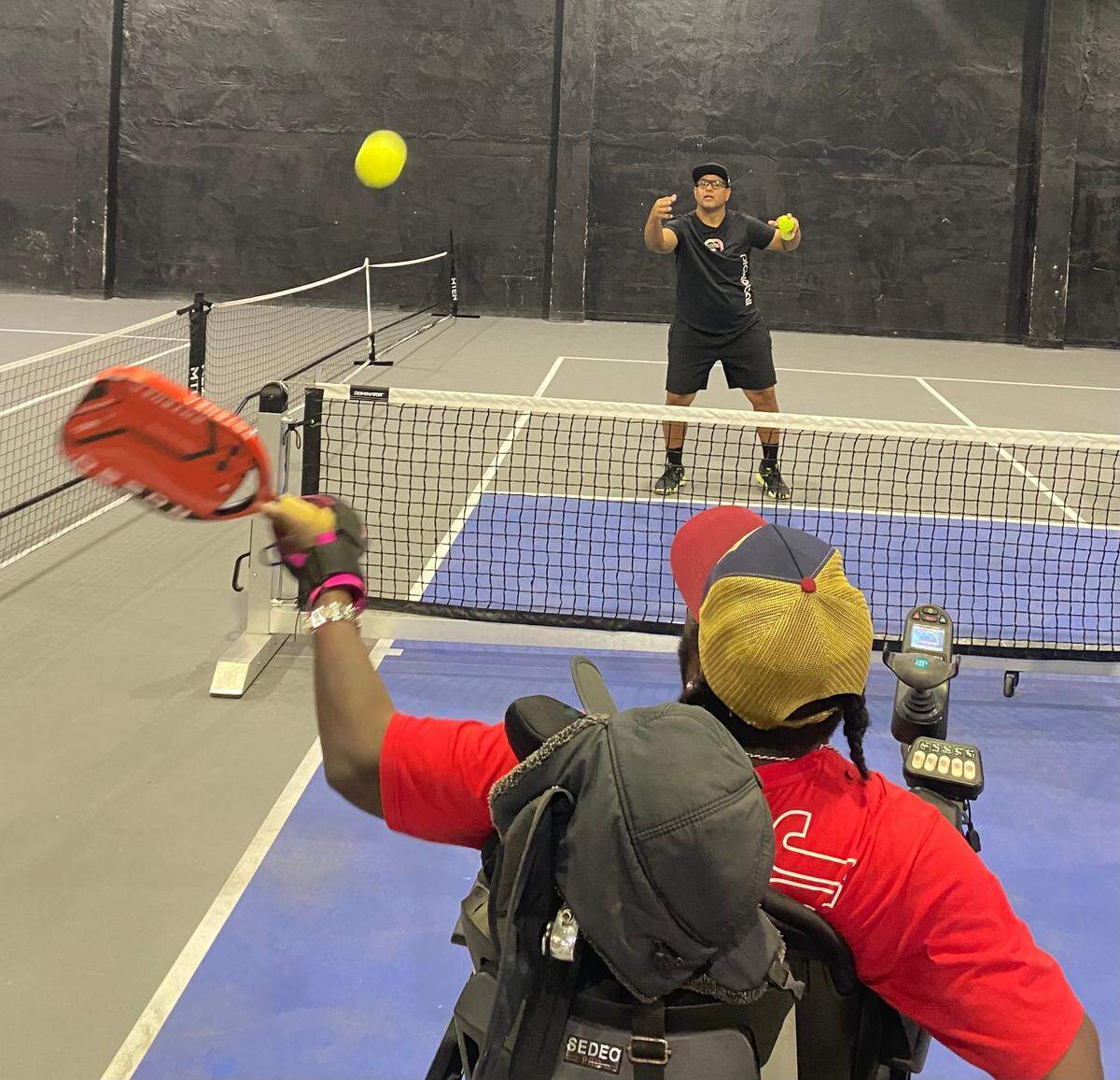 Carlos Marquez, a 47-year-old native of Venezuela, is the pickleball coach for a program at Doral’s Champions club, which helps athletes with disabilities.