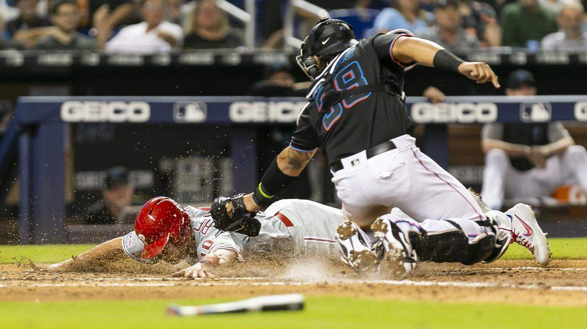 Jorge Alfaro, seen here attempting to tag out Philadelphia Phillies catcher J.T. Realmuto (10) on Friday, April 12, 2019, had two hits against his former team and has started to become a more vocal presence for the Marlins this year.