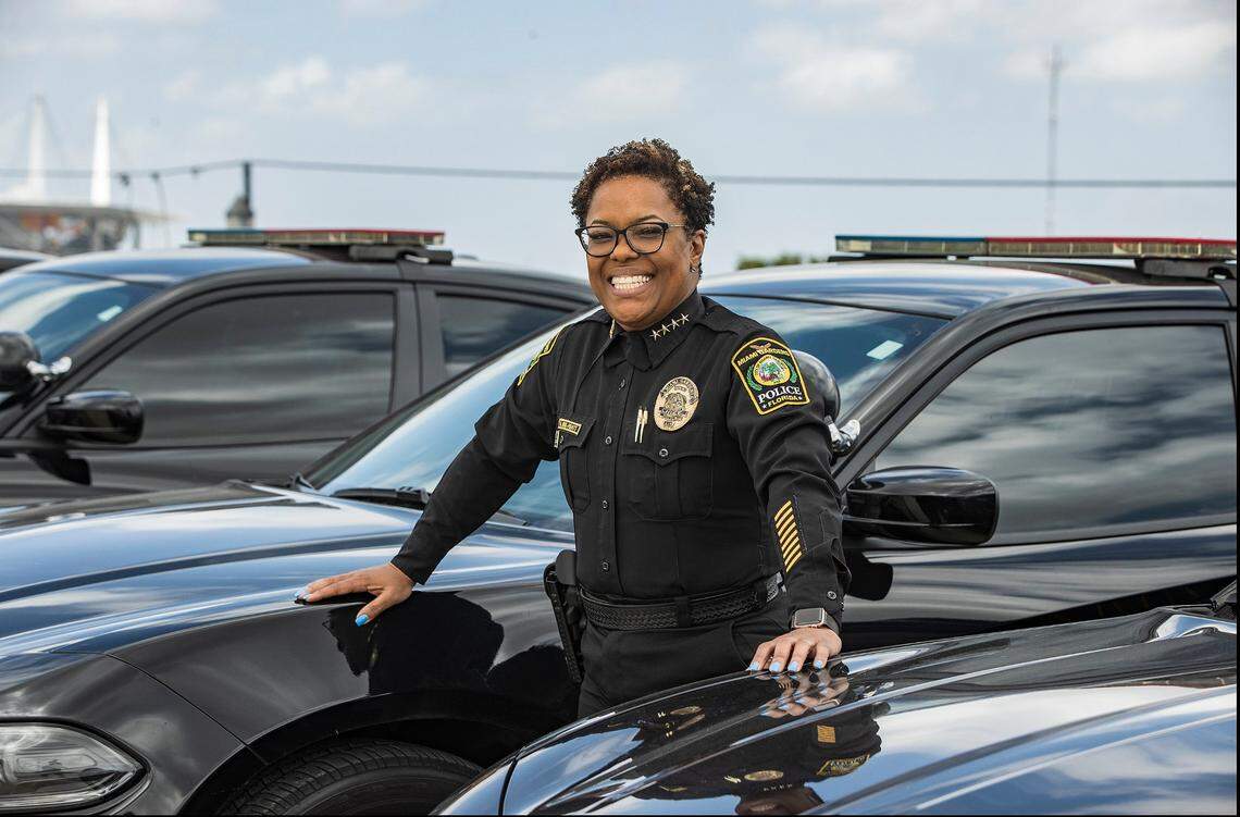 Miami Gardens Police Chief Delma Noel-Pratt, the first female police chief named in Miami Gardens in 2017, stands next to a police cruiser in 2022.