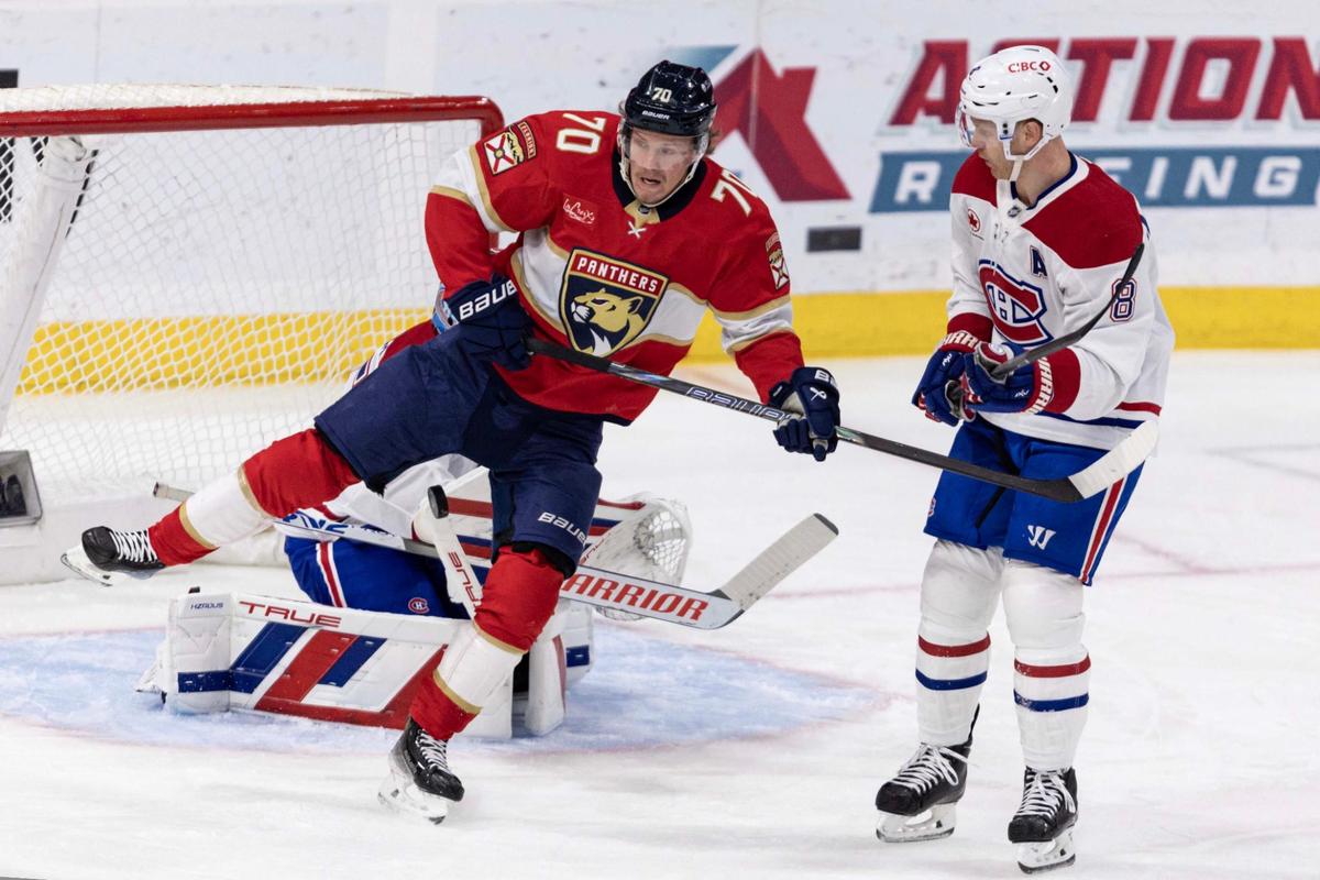 Florida Panthers center Jesper Boqvist (70) jumps to avoid a shot on Montreal Canadiens goaltender Sam Montembeault (35) as defenseman Mike Matheson (8) looks on during the first period of an NHL game at Amerant Bank Arena on Sunday, March 30, 2025, in Sunrise, Fla.