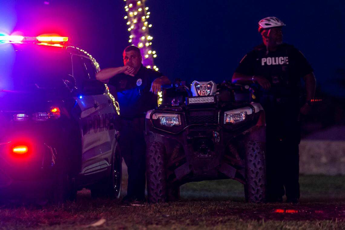 Police keep an eye on tourists along Ocean Drive during spring break in Miami Beach on Monday, March 22, 2021.